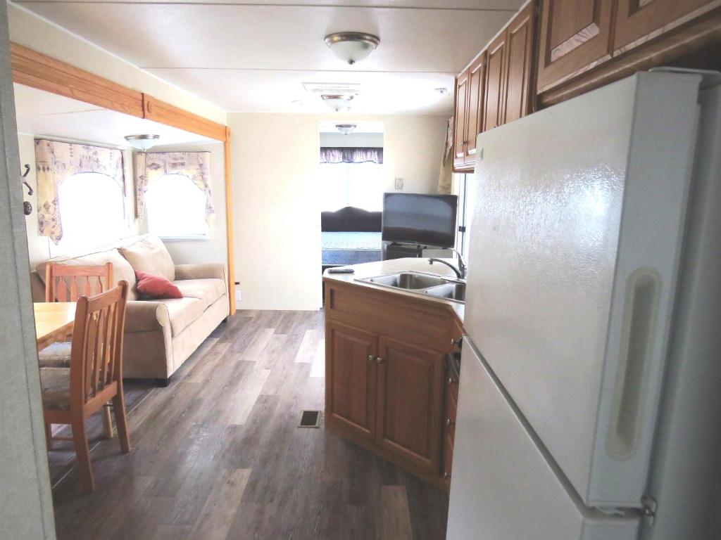 a kitchen and living room of a caravan at Boardwalk RV Rental (Site #14) in Cavendish