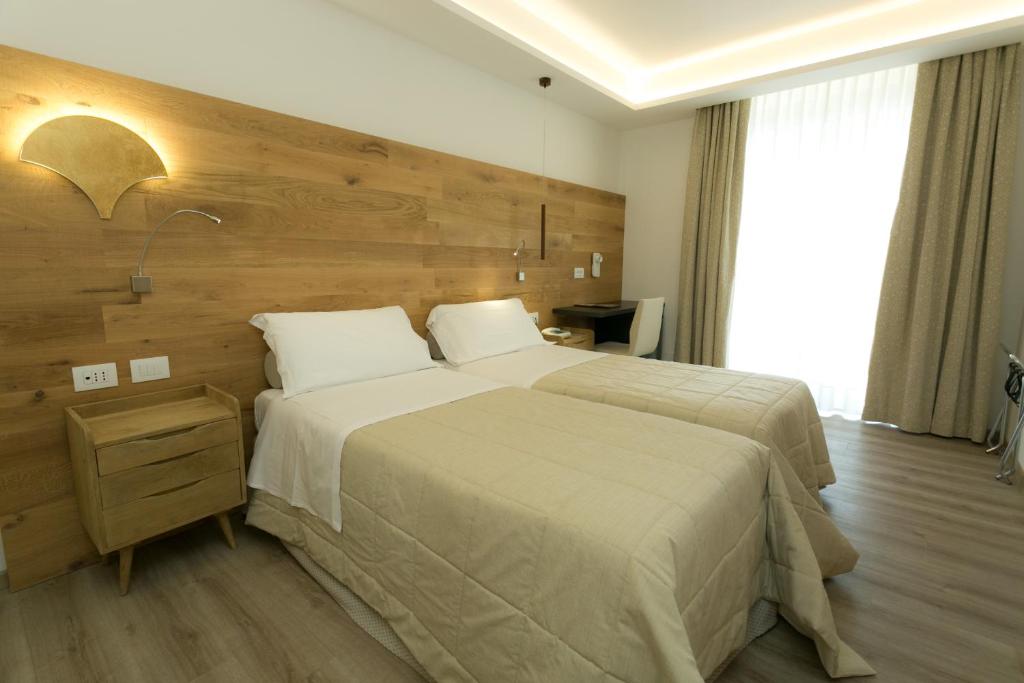 Postel nebo postele na pokoji v ubytování Hotel Terme Abano Verdi
