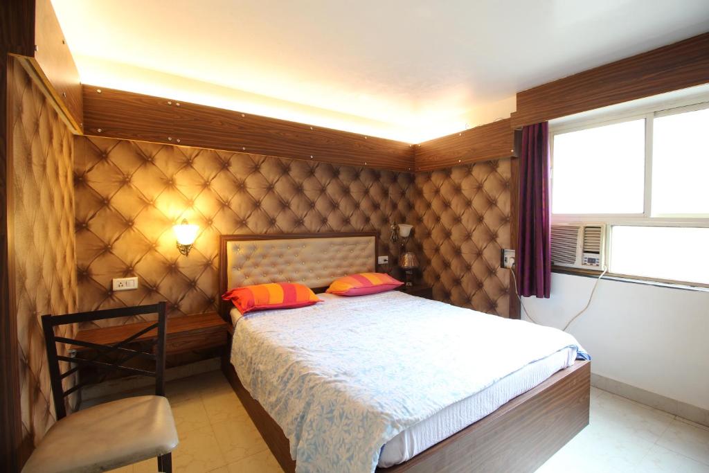 Postel nebo postele na pokoji v ubytování Roundcube Guest House