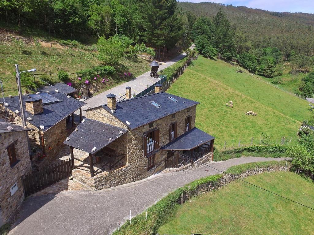 an aerial view of an old building on a hill at Apartamentos A Casa Nova in A Pontenova