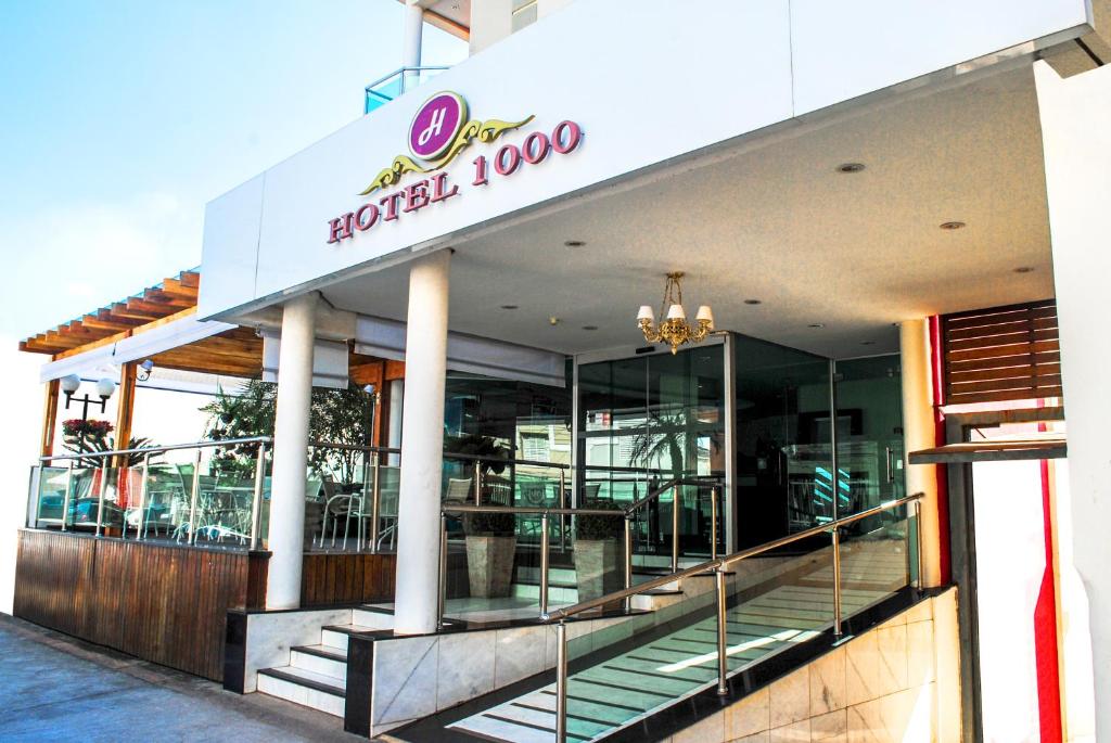 a hotel building with stairs in front of it at Hotel 1000 in Piracicaba