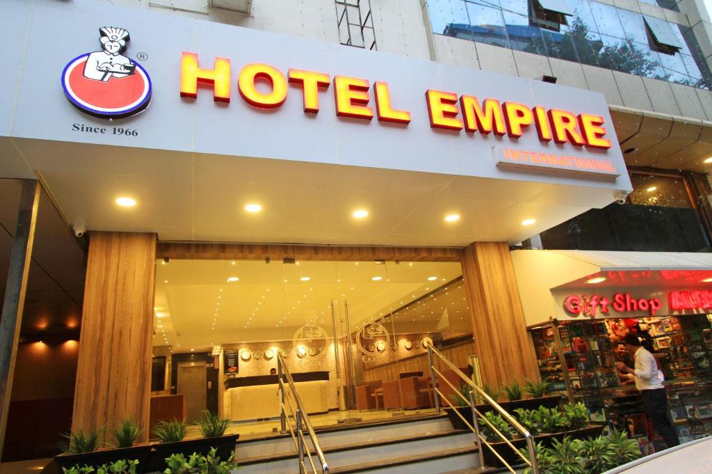 a hotel entrance with a hotel empire sign on it at Empire International Church Street in Bangalore
