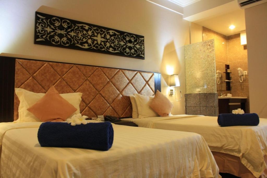 Postel nebo postele na pokoji v ubytování Beringgis Beach Resort & Spa