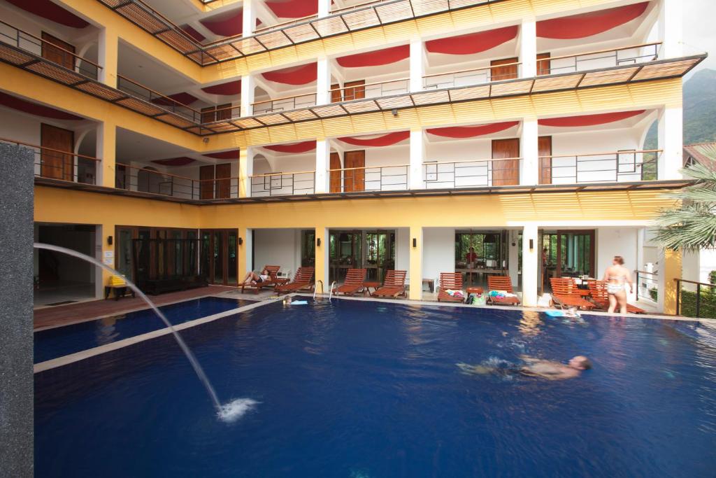 a swimming pool in a hotel with people in the water at Keeree Ele Resort in Ko Chang