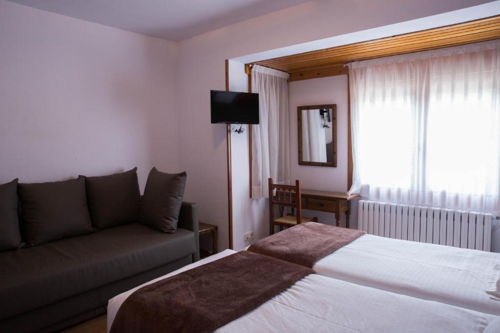 Postel nebo postele na pokoji v ubytování Hotel Bruna