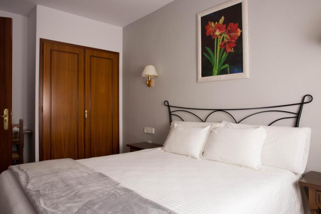 Postel nebo postele na pokoji v ubytování Hotel Bruna