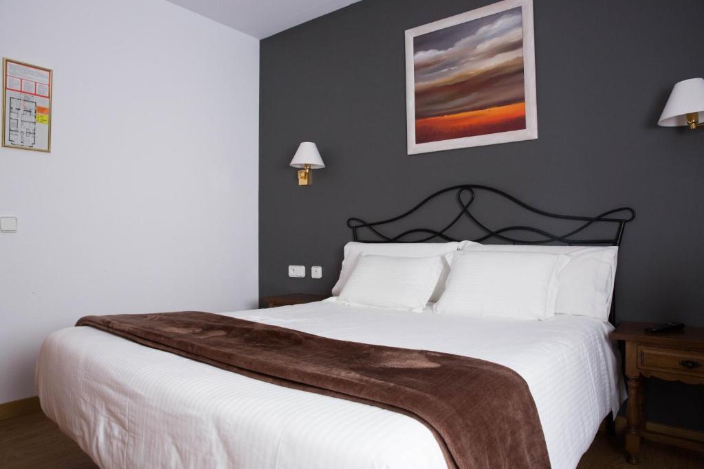 Postel nebo postele na pokoji v ubytování Hotel Bruna