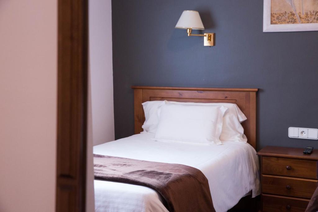 Postel nebo postele na pokoji v ubytování Hotel Bruna