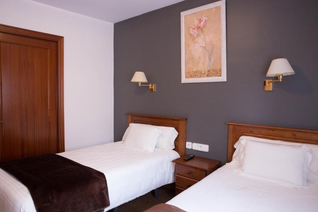 Postel nebo postele na pokoji v ubytování Hotel Bruna
