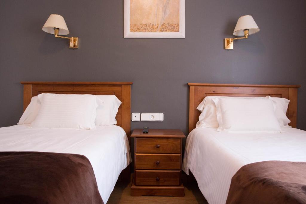 Postel nebo postele na pokoji v ubytování Hotel Bruna