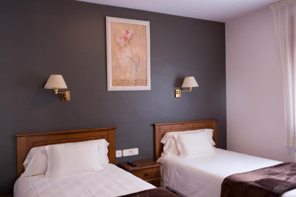 Postel nebo postele na pokoji v ubytování Hotel Bruna