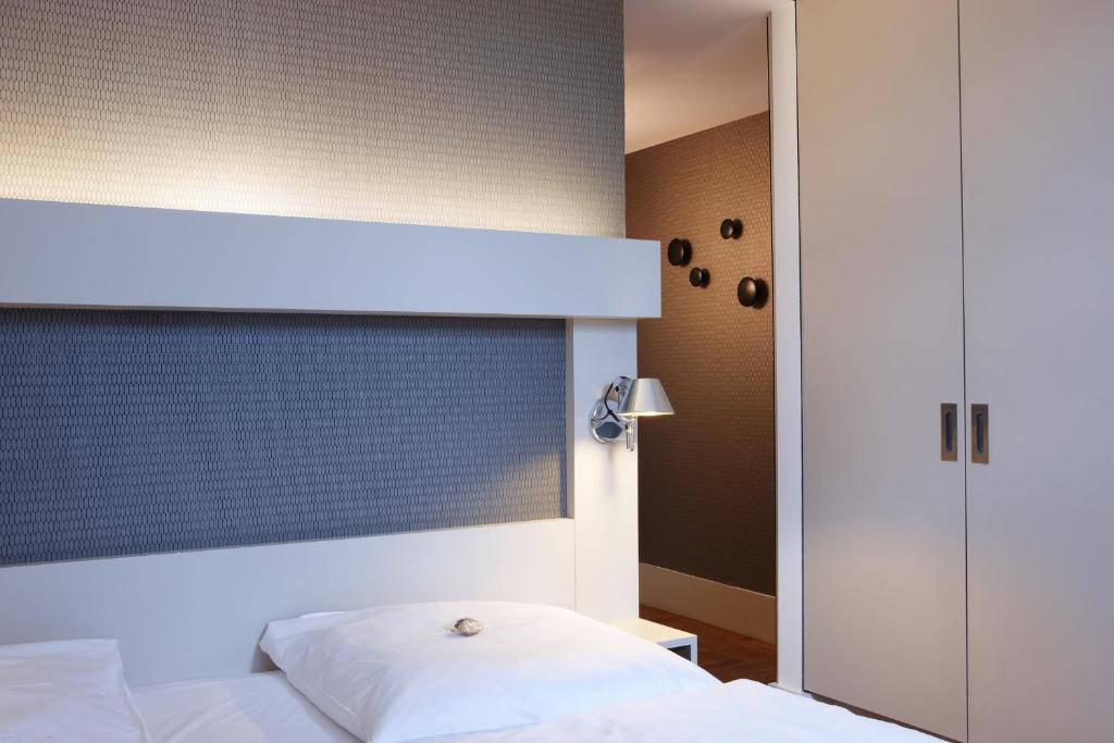 Postel nebo postele na pokoji v ubytování Hotel AMANO Rooms & Apartments