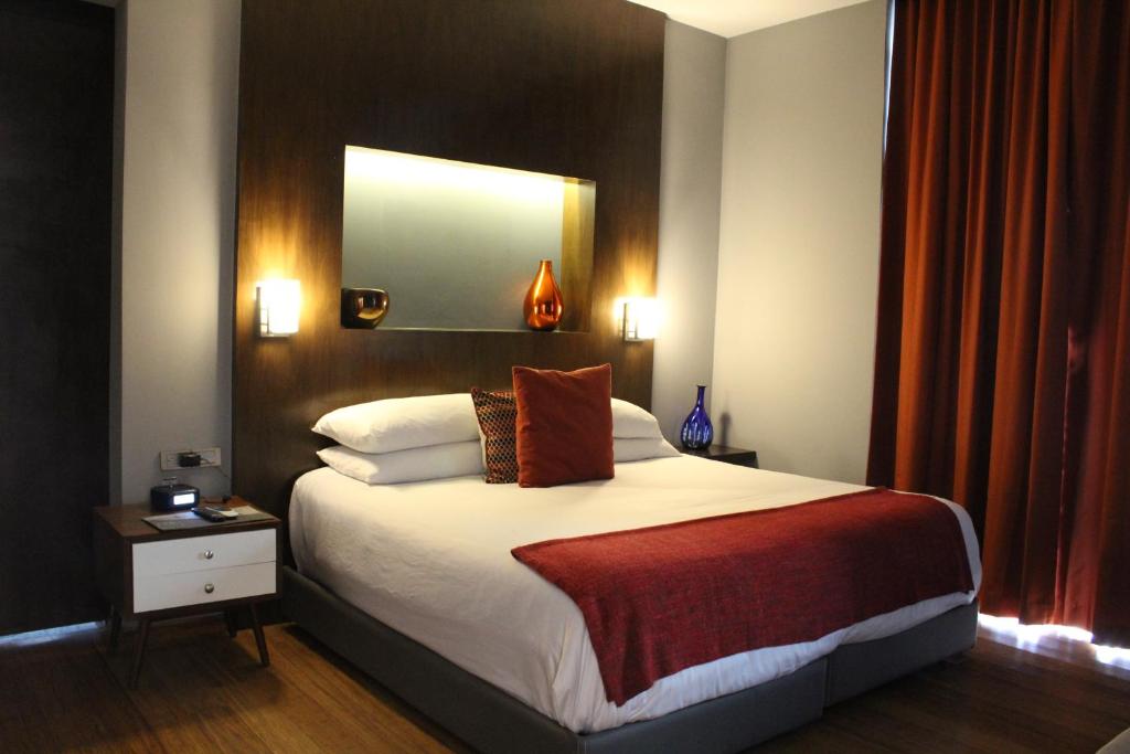 Postel nebo postele na pokoji v ubytování Hotel Love It CAS Consulado