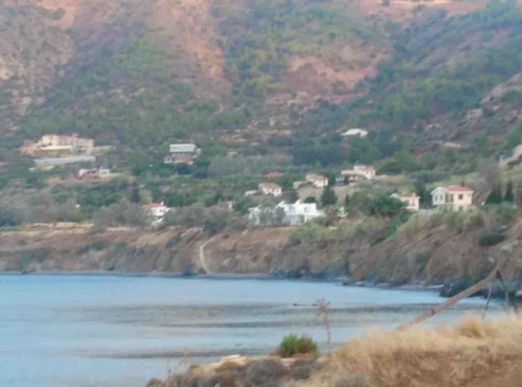 a body of water with houses on a mountain at Pomos Harbourbiew Villa in Pomos