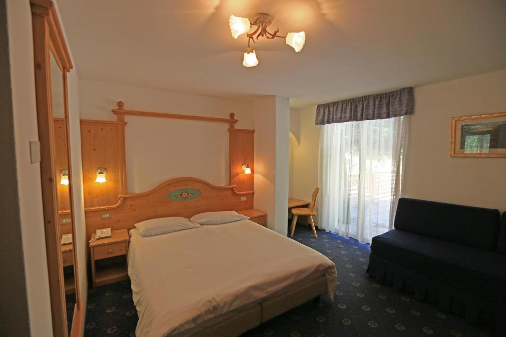 Postel nebo postele na pokoji v ubytování Hotel Valacia