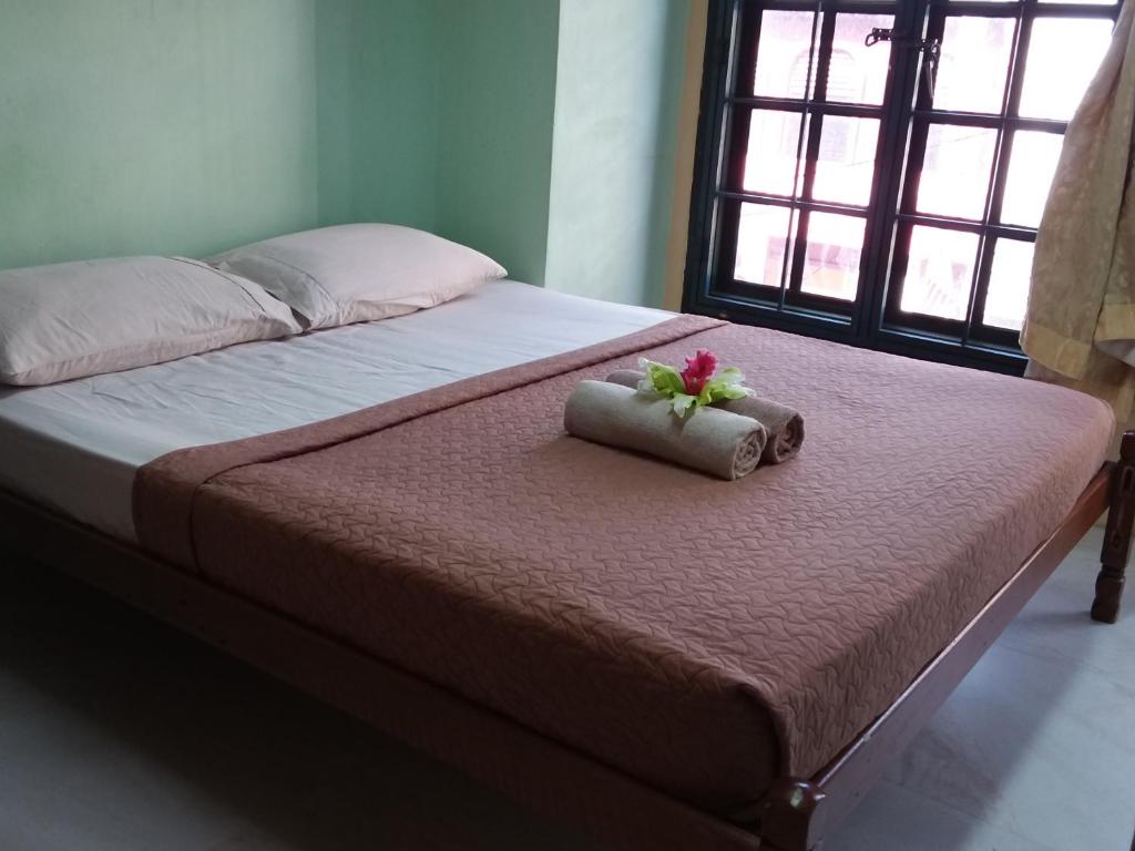 Postel nebo postele na pokoji v ubytování Oasis Guest House