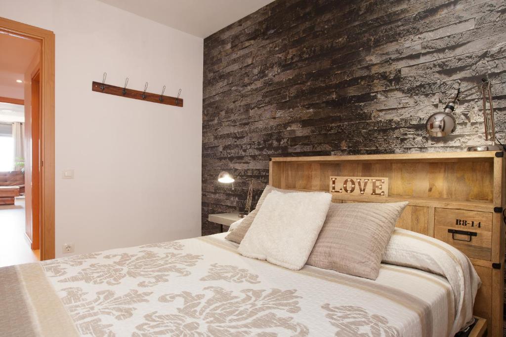 Łóżko lub łóżka w pokoju w obiekcie Apartment Beach Front Canet