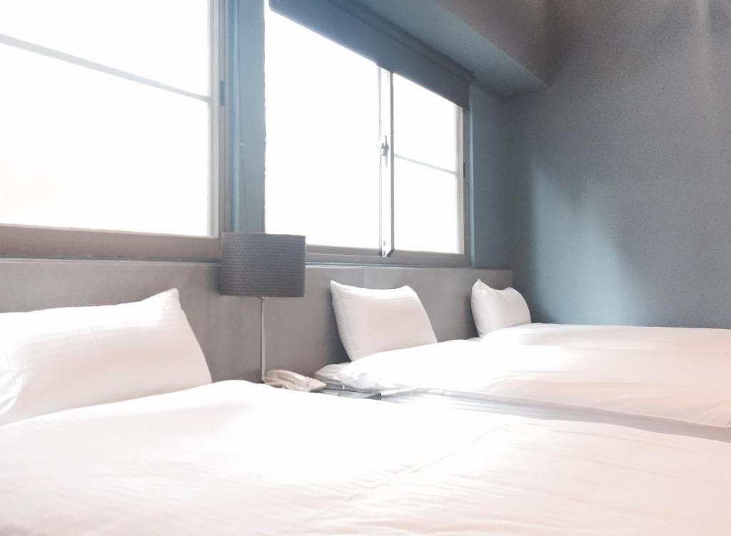 Postel nebo postele na pokoji v ubytování Bear Hotel