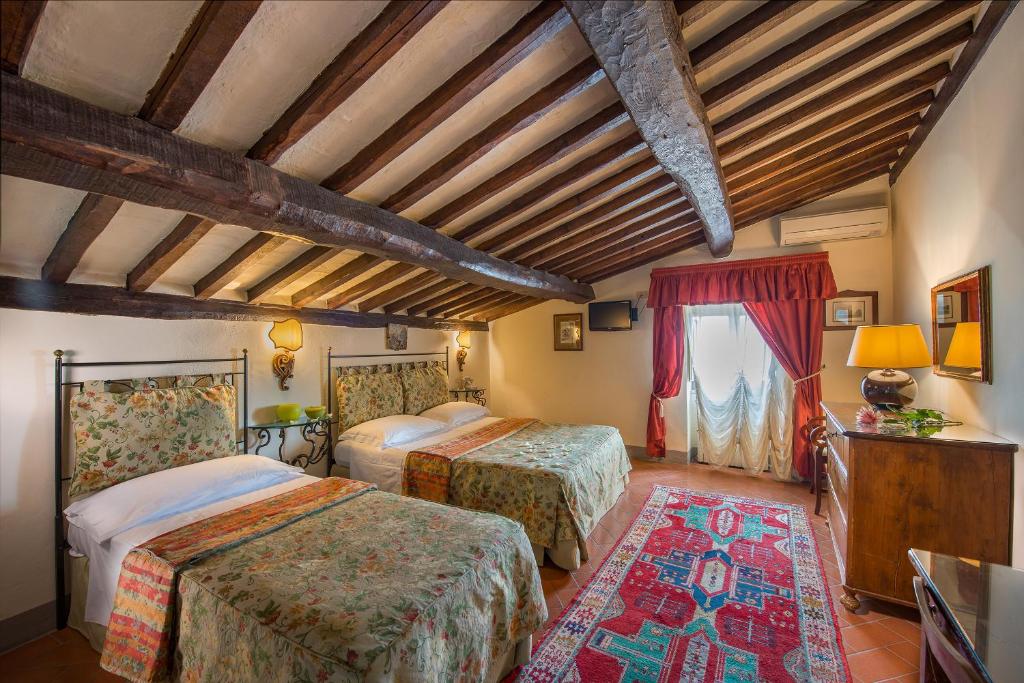 Postel nebo postele na pokoji v ubytování Hotel San Michele