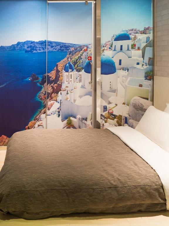 Postel nebo postele na pokoji v ubytování E-House Hotel