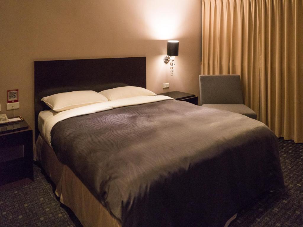 Postel nebo postele na pokoji v ubytování E-House Hotel