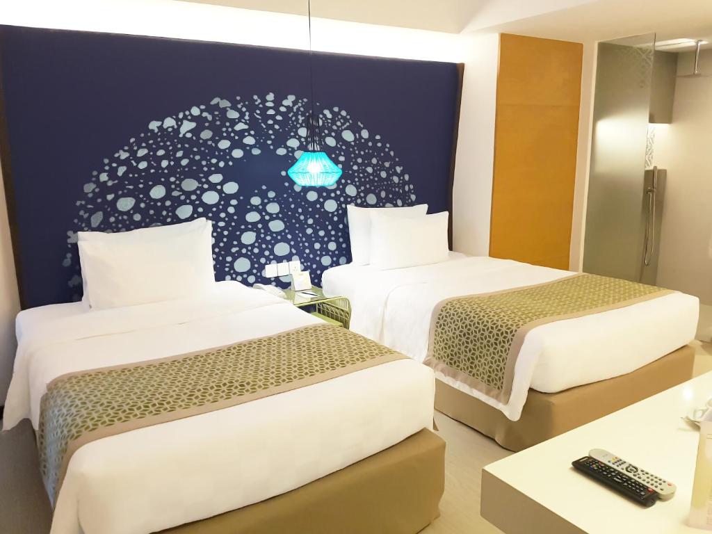 Uma cama ou camas num quarto em Hue Hotels and Resorts Boracay Managed by HII