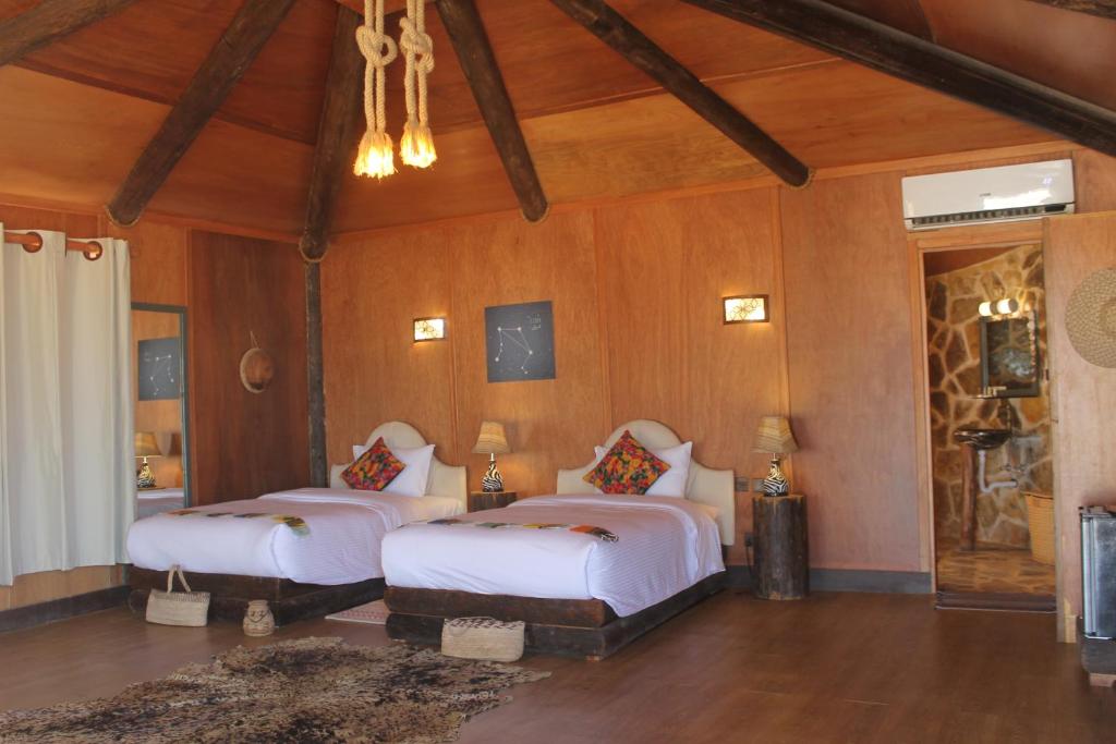 Postel nebo postele na pokoji v ubytování Souly Ecolodge Salalah