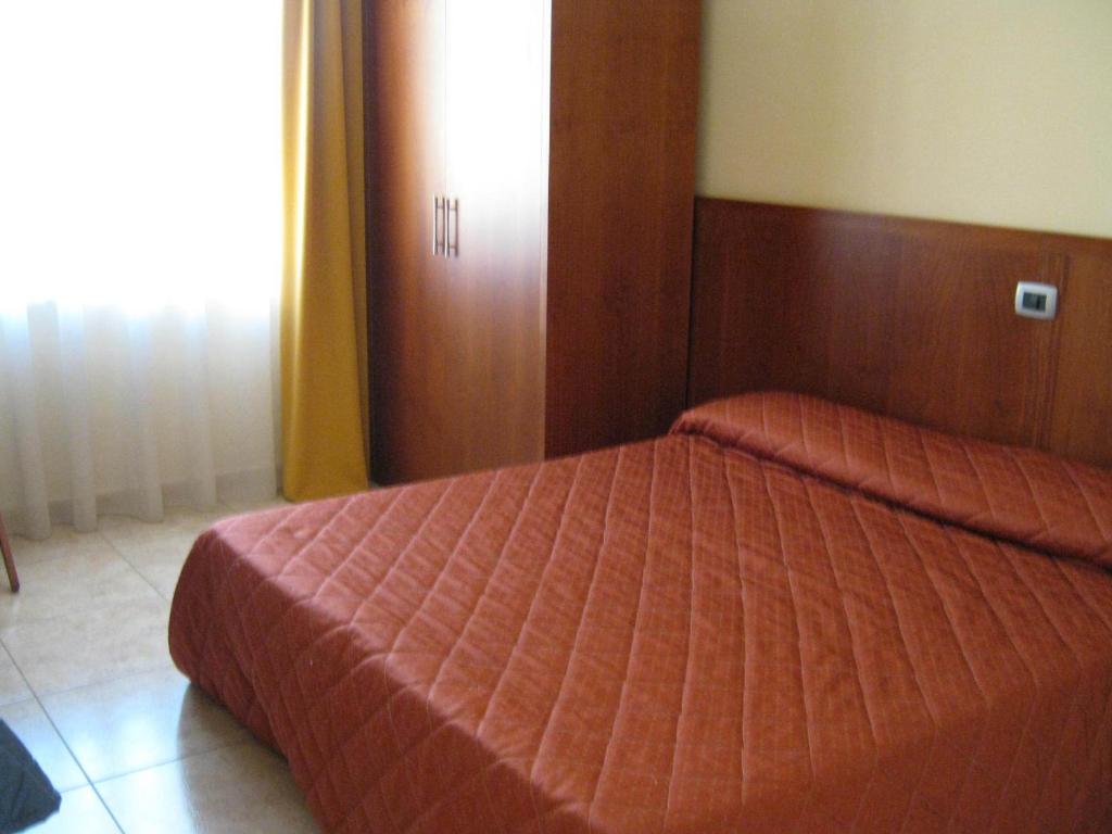 Cama ou camas em um quarto em Hotel San Martino