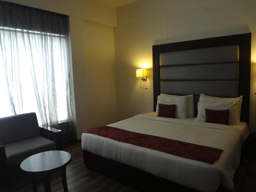 Postel nebo postele na pokoji v ubytování Veronica Hotel