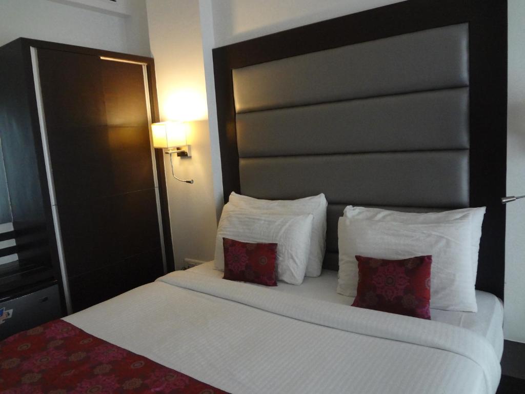 Postel nebo postele na pokoji v ubytování Veronica Hotel