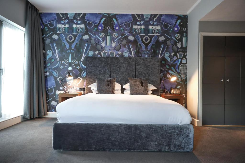 A bed or beds in a room at Malmaison Hotel Leeds