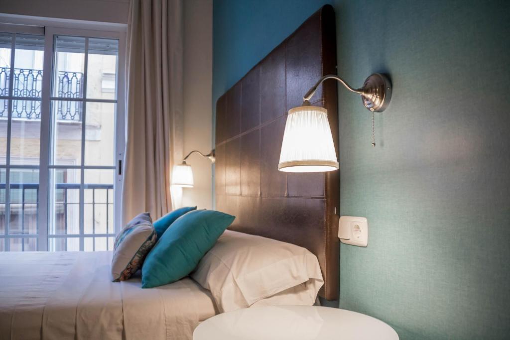 Posteľ alebo postele v izbe v ubytovaní Apartamento Ulises Suite 1