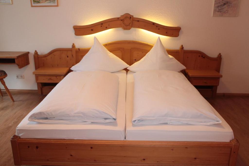 Postel nebo postele na pokoji v ubytování Adler Post