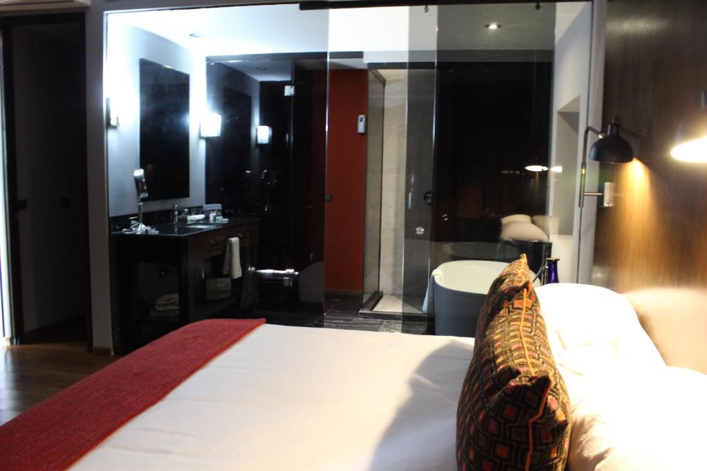 Postel nebo postele na pokoji v ubytování Hotel Love It CAS Consulado