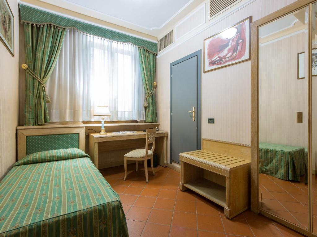 Łóżko lub łóżka w pokoju w obiekcie Hotel Panama