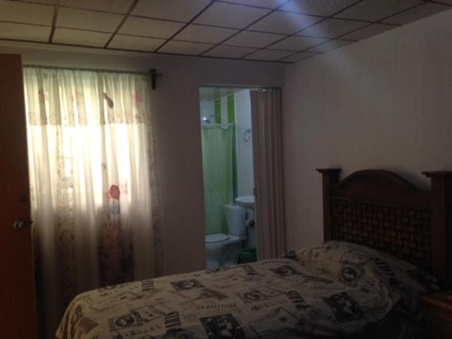 Postel nebo postele na pokoji v ubytování Hostal Makea Pachuca