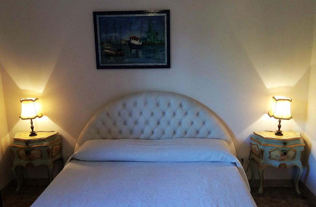 Łóżko lub łóżka w pokoju w obiekcie B&B Pergolesi