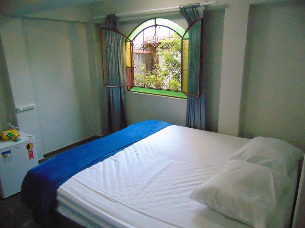 A bed or beds in a room at Pousada Tamboril