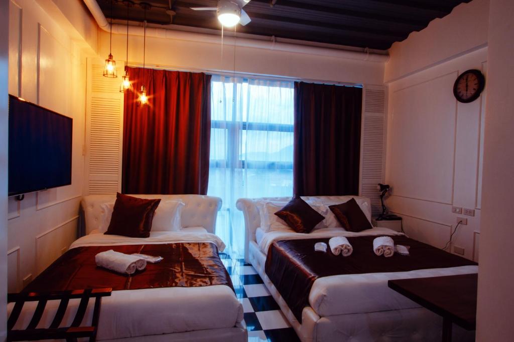 Postel nebo postele na pokoji v ubytování Facade Hotel