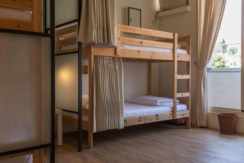 a bunk bed room with two bunk beds at Sleeping Boot Hostel in Hualien City