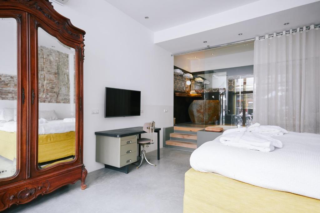 Postel nebo postele na pokoji v ubytování Hotel Karel