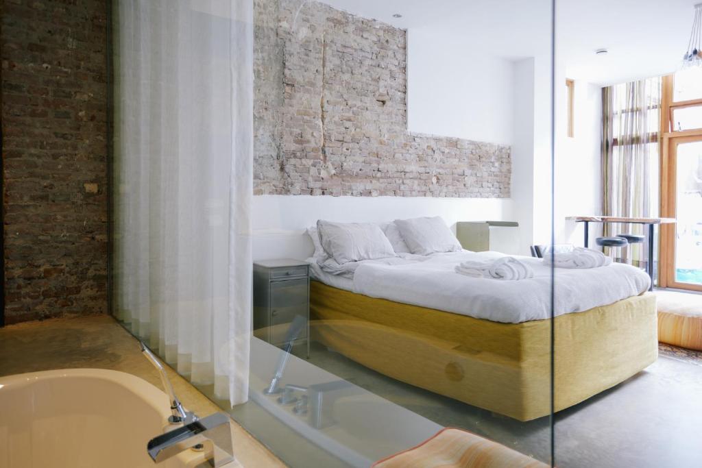 Postel nebo postele na pokoji v ubytování Hotel Karel