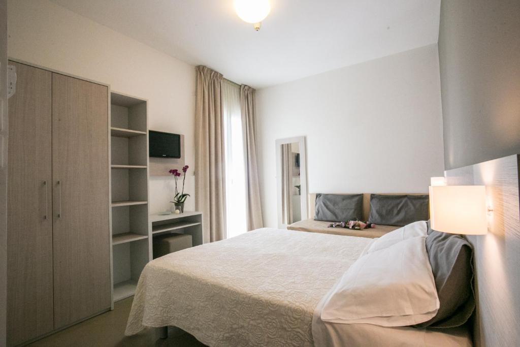 Postel nebo postele na pokoji v ubytování Hotel Caesar
