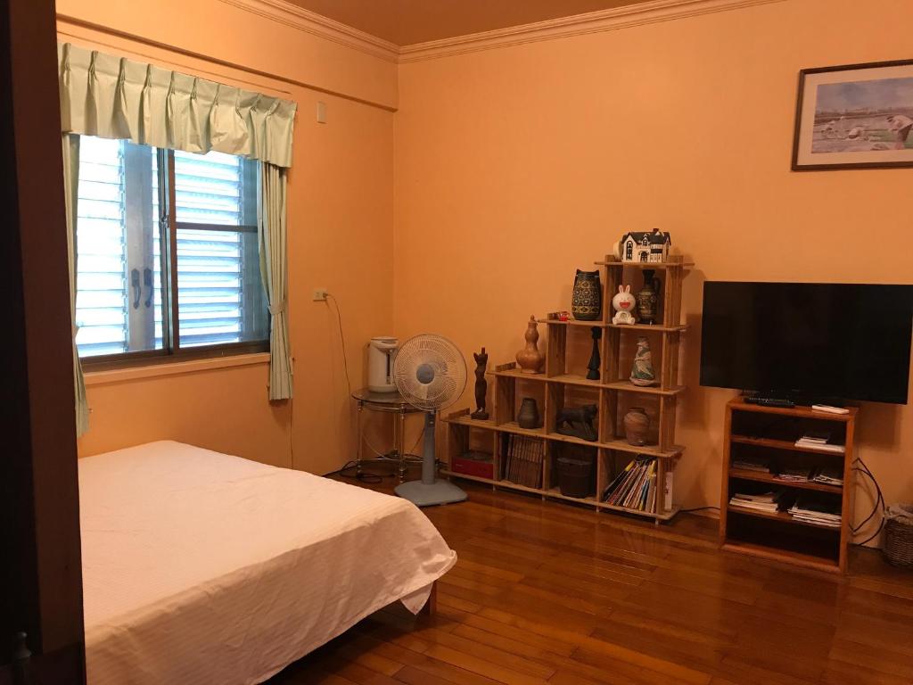 Postel nebo postele na pokoji v ubytování Sin Ya Homestay