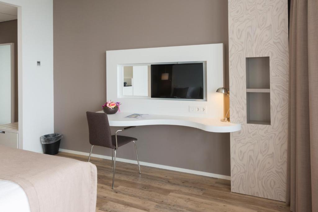 TV a/nebo společenská místnost v ubytování Fletcher Hotel-Restaurant de Wageningsche Berg