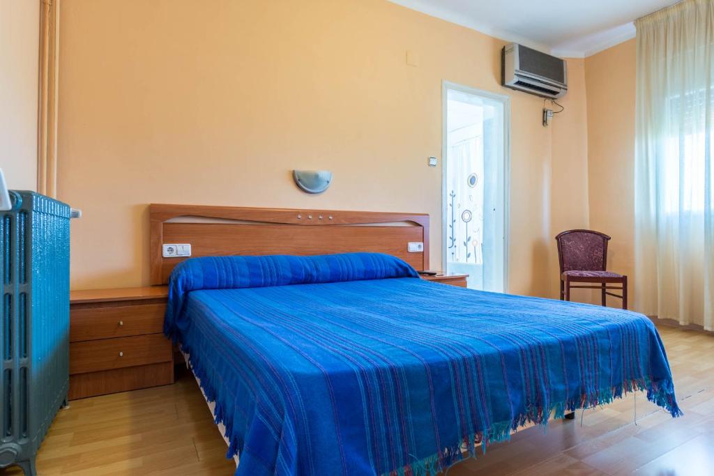 Posteľ alebo postele v izbe v ubytovaní Hostal Urgell