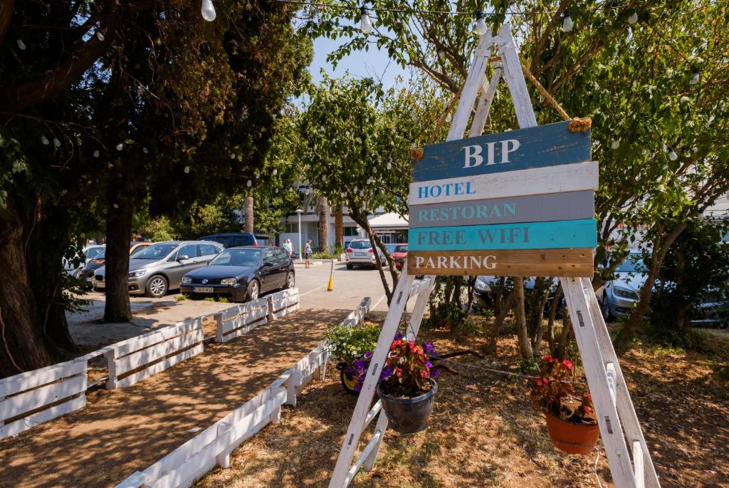 a sign for a street in a parking lot at Hotel BIP in Budva