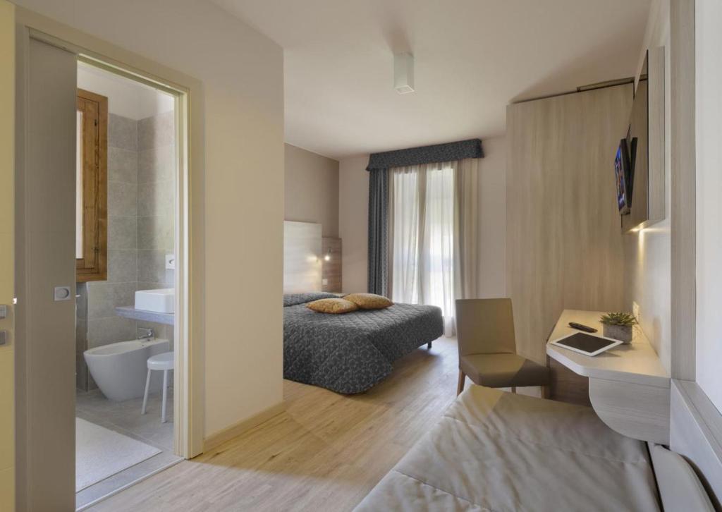 Posteľ alebo postele v izbe v ubytovaní Locanda Benetti