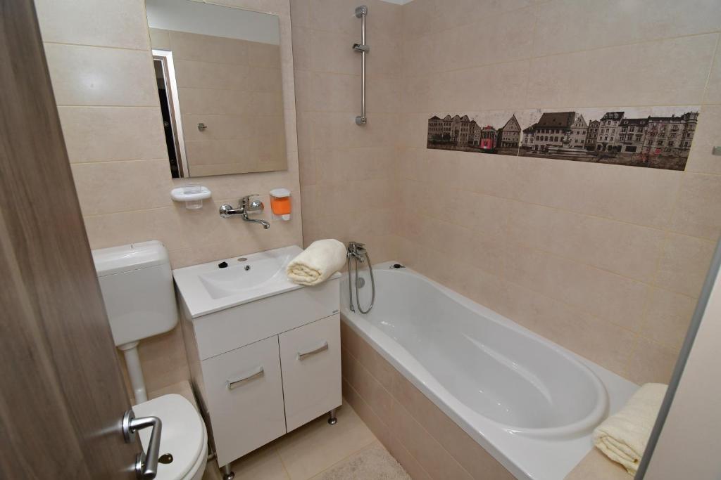 Koupelna v ubytování City Premium Apartments