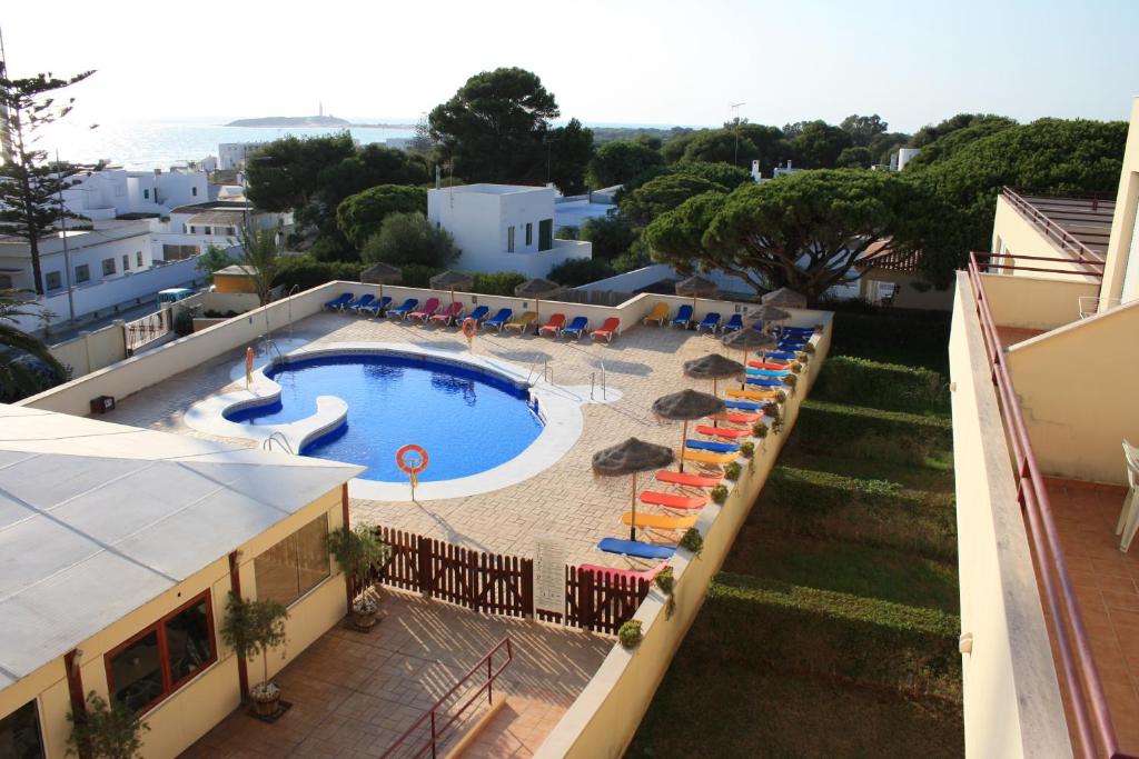 a view of a swimming pool in a resort at Apartamentos Turisticos Caños de Meca in Los Caños de Meca